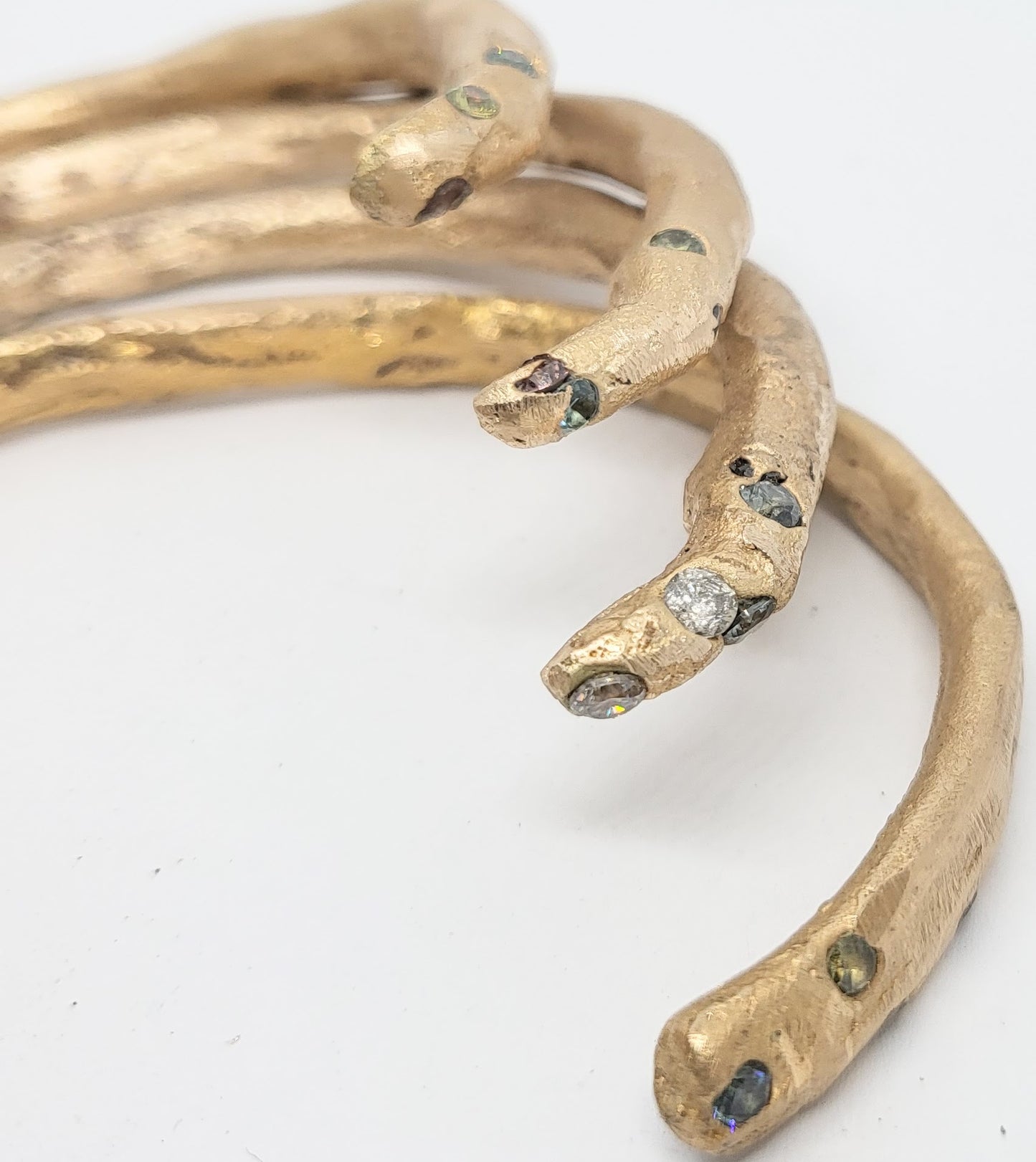 Medieval-inspired handcrafted 9ct gold bangle with rubies and / or sapphires