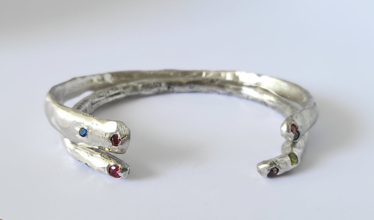 Medieval-inspired sterling silver handcrafted bangle with rubies and / or sapphires