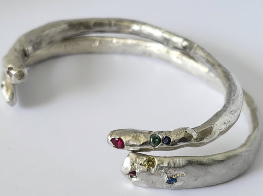 Medieval-inspired sterling silver handcrafted bangle with rubies and / or sapphires