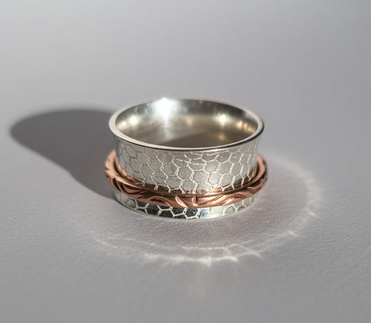 Buddhist-inspired handcrafted sterling silver and copper fidget / meditation ring